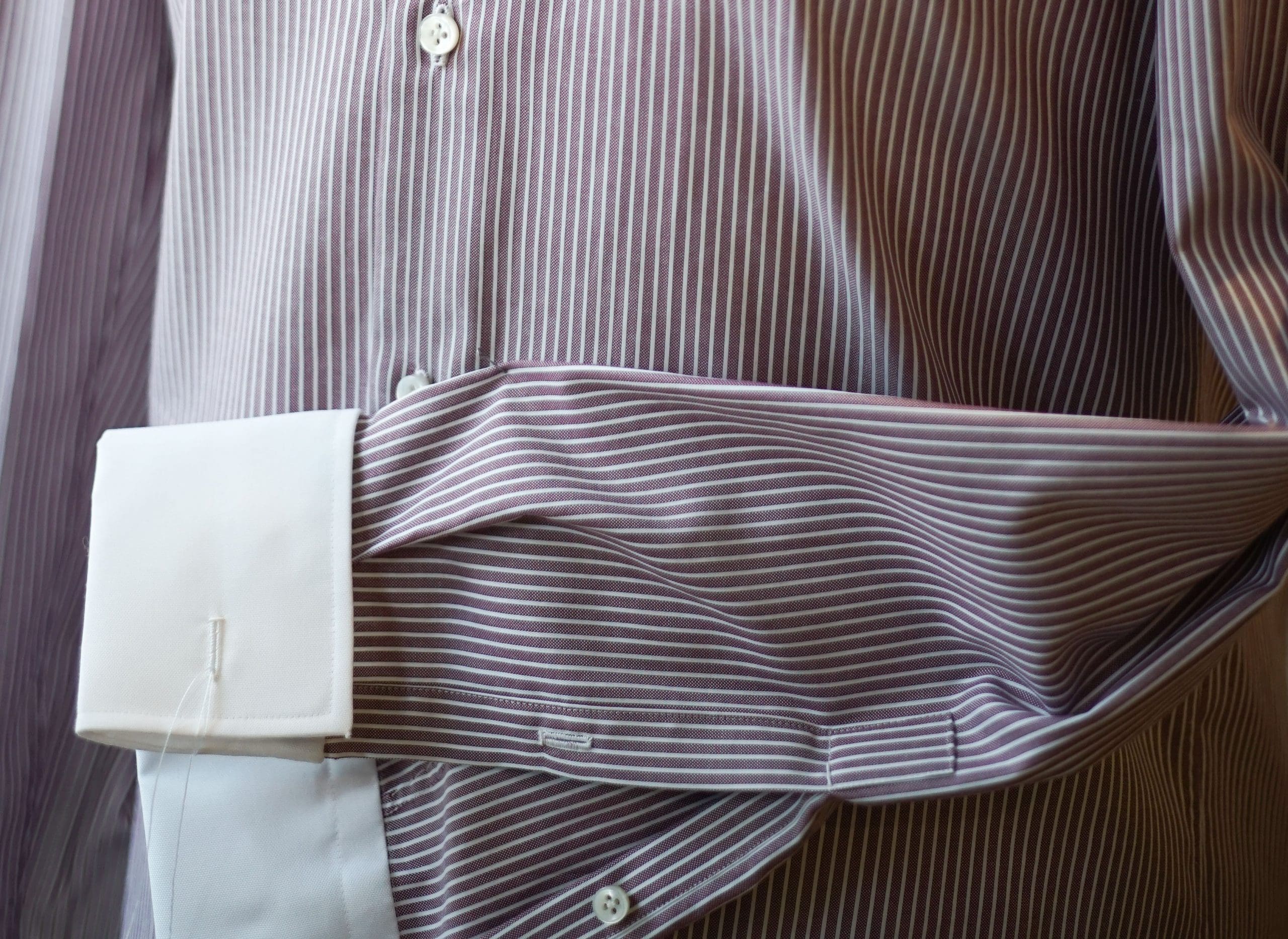 A shirt's sleeve folder over some fabric