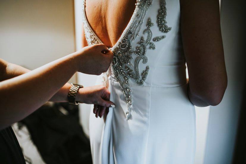 back of a wedding dress with silver embellishments